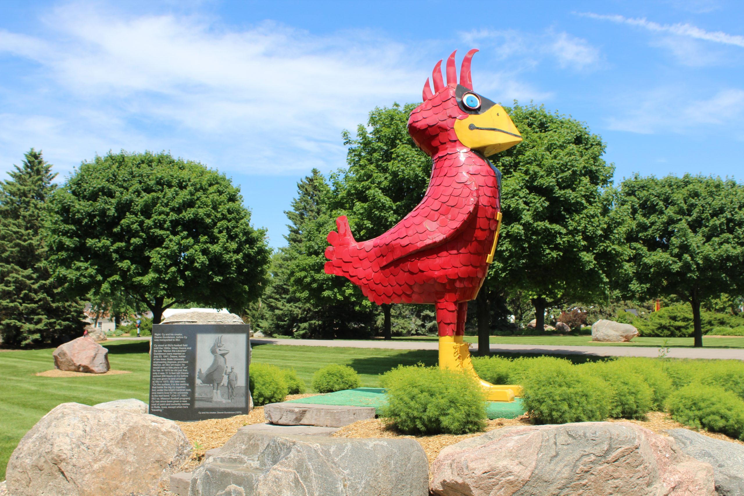 Cy statue on Allen property in Rolfe