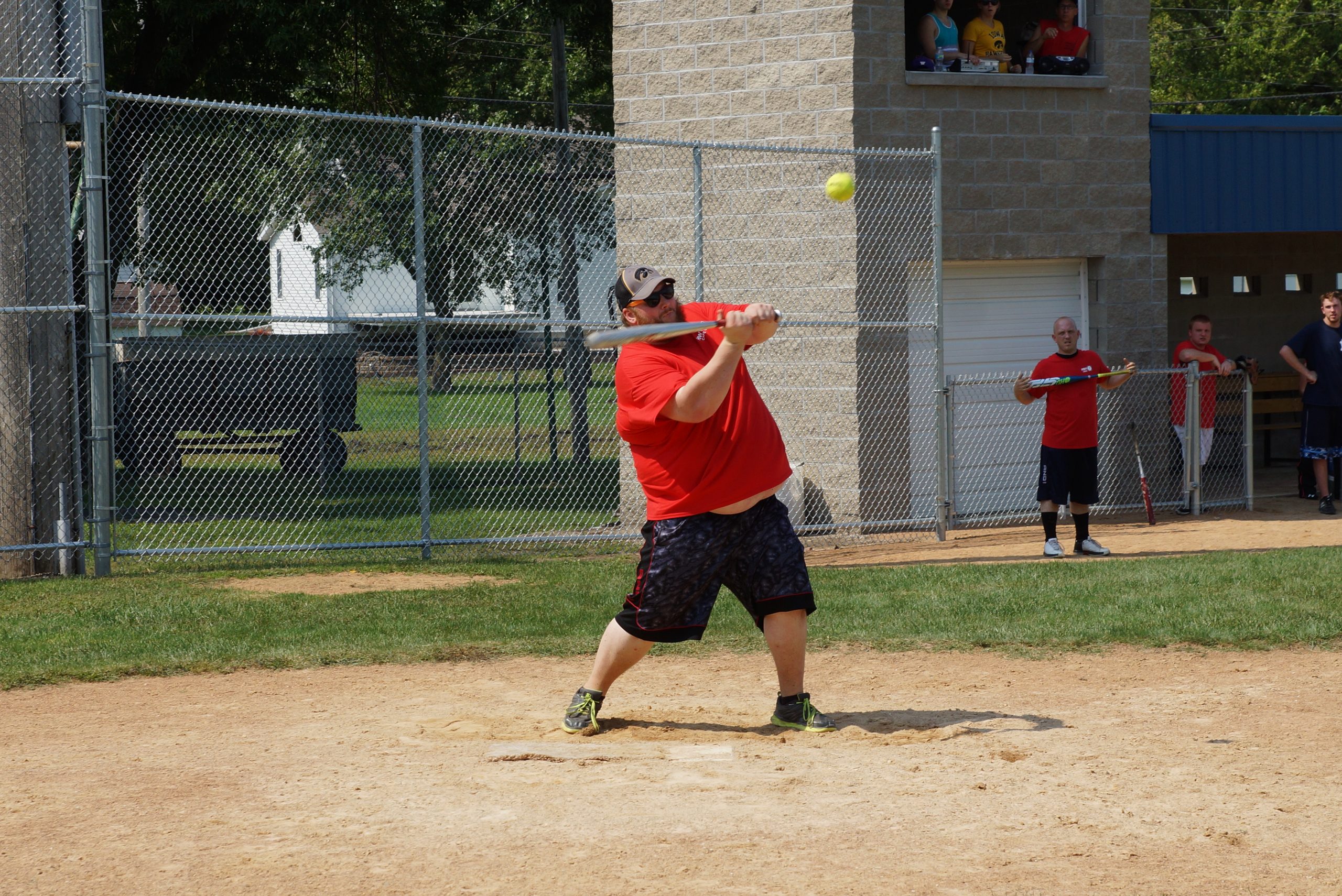 Ryan Shaffer, Manager of the HWY 7 slow pitch team takes a cut at the ball